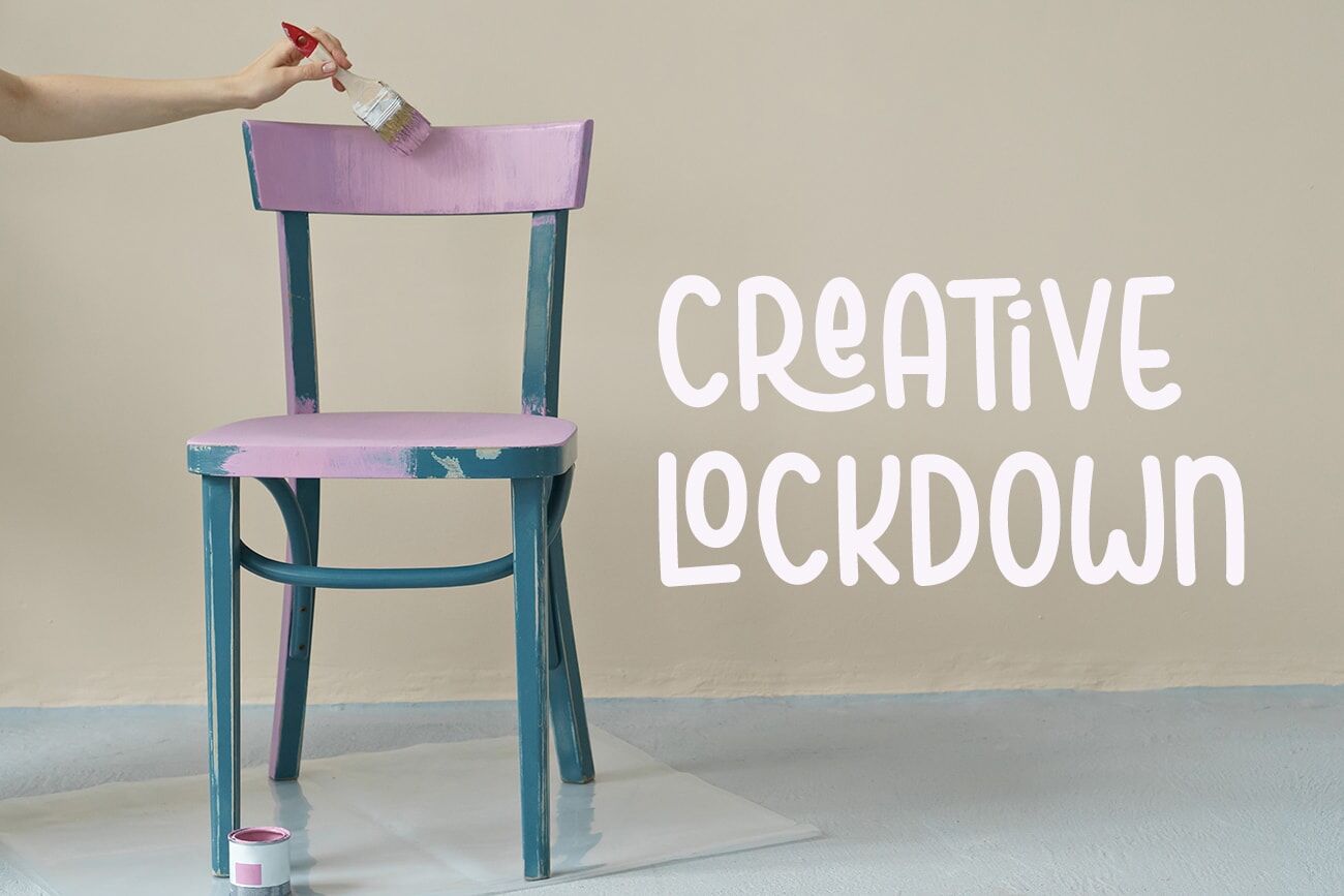woman's hand painting chair in pink at home woman's hand painting chair in pink at home