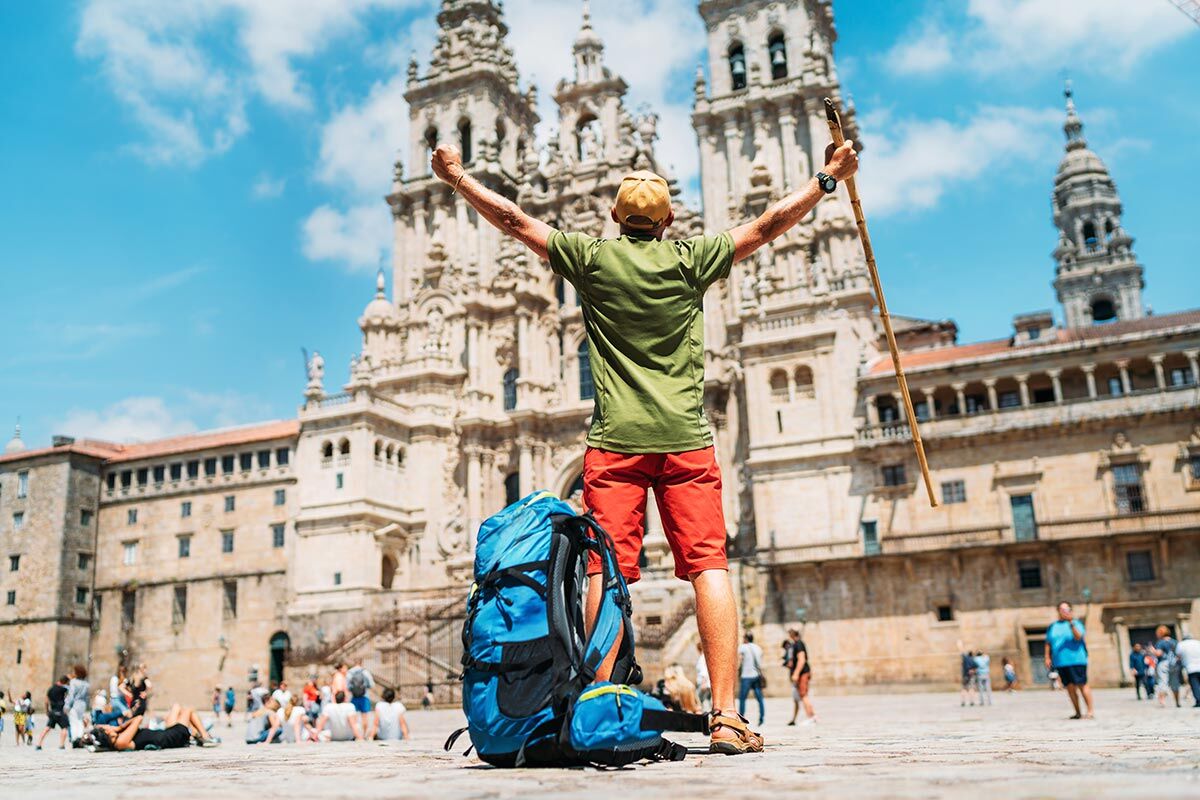 Pilgrim with rucksack at Santiago de Compostella