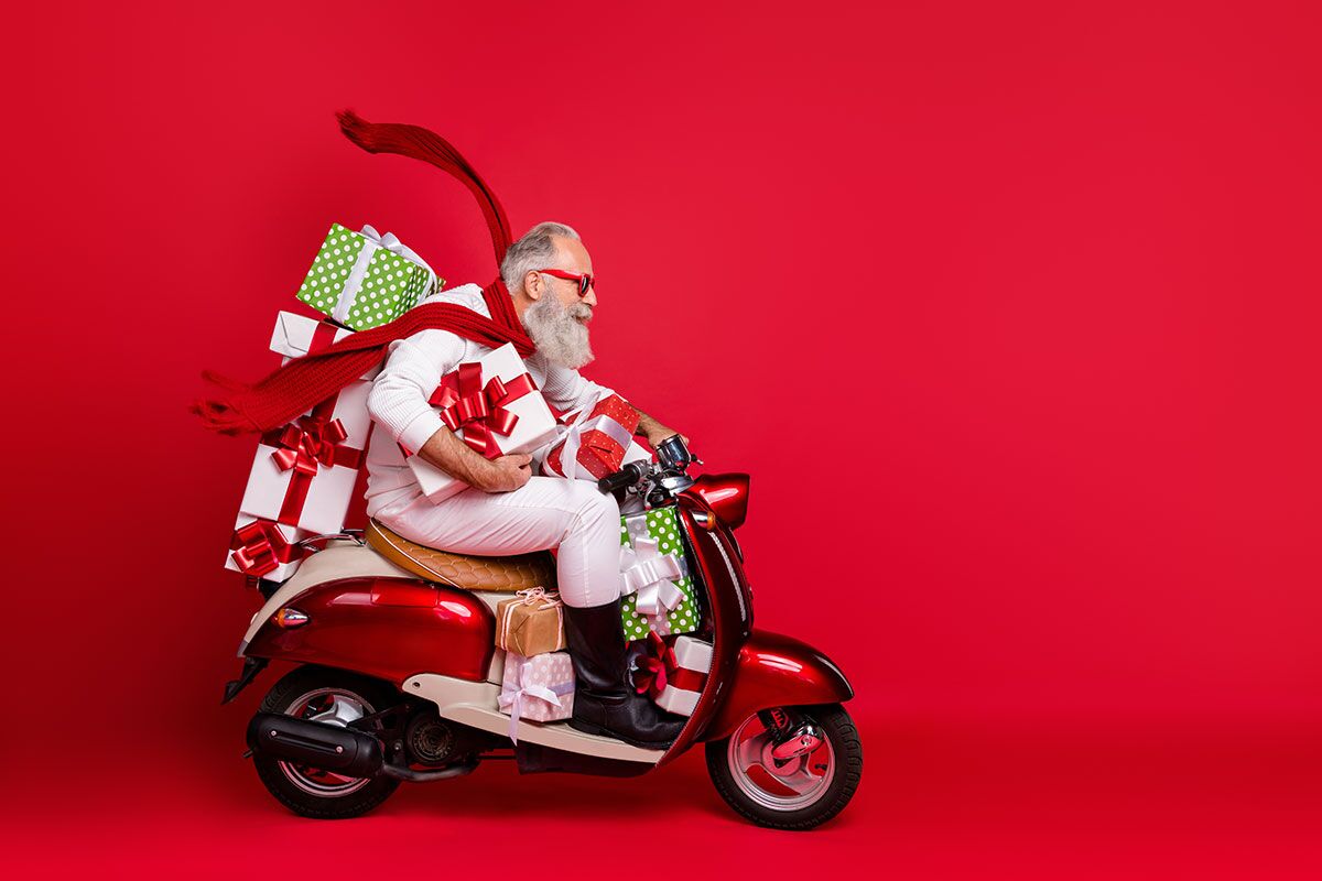 Father Chritmas on a moped with presents