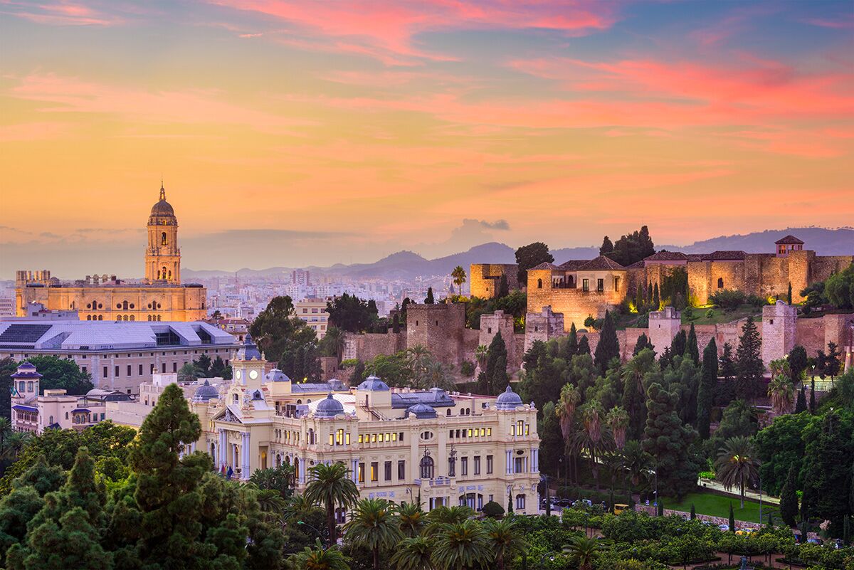 Malaga Cathedral, Town Hall and Alcazaba at sunset.