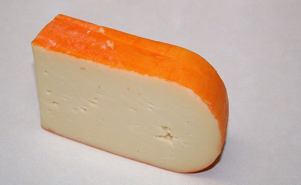 Spain-top-10-cheeses-01 Mahón cheese is distinctive as it is hand-rubbed with either butter, oil or paprika during maturation